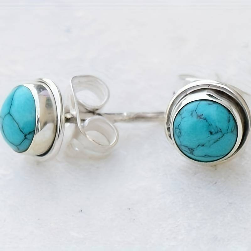 Boucles d'oreilles vintage incrustées de pierres bleues