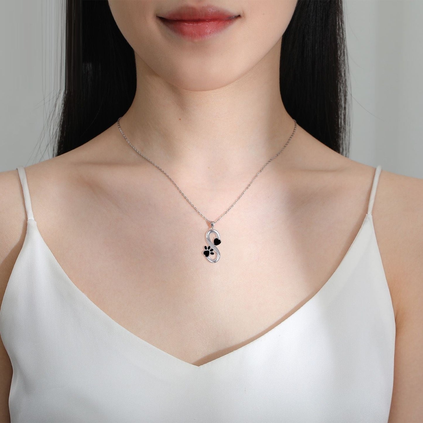 Collier symbole infini cœurs empreinte de patte