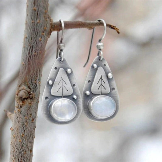 Boucles d'oreilles bohèmes avec opale blanche en argent