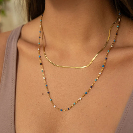 Collier vintage en or avec pierres bleues