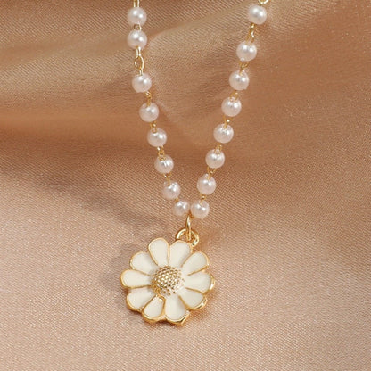 Pendentif marguerite avec perles