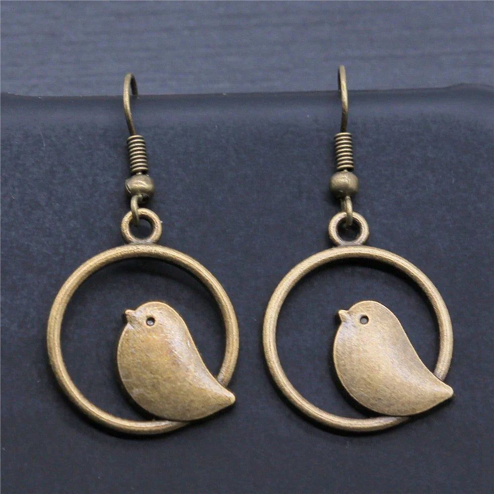 Boucles d'oreilles pendantes vintage avec pendentif oiseau – Bijoux bohèmes faits main