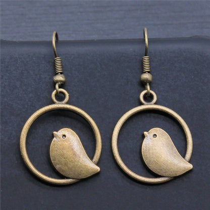Boucles d'oreilles pendantes vintage avec pendentif oiseau – Bijoux bohèmes faits main