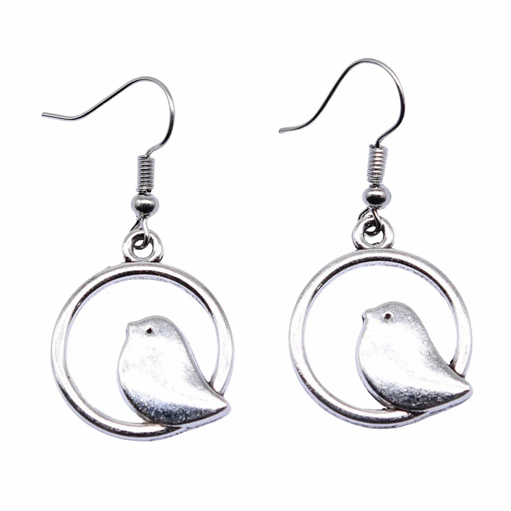 Boucles d'oreilles pendantes vintage avec pendentif oiseau – Bijoux bohèmes faits main