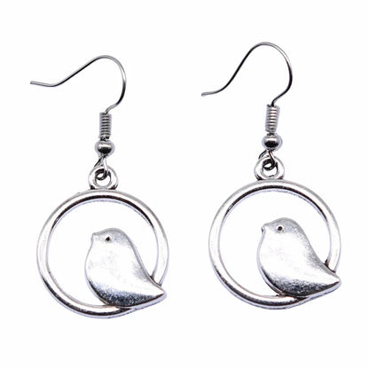 Boucles d'oreilles pendantes vintage avec pendentif oiseau – Bijoux bohèmes faits main