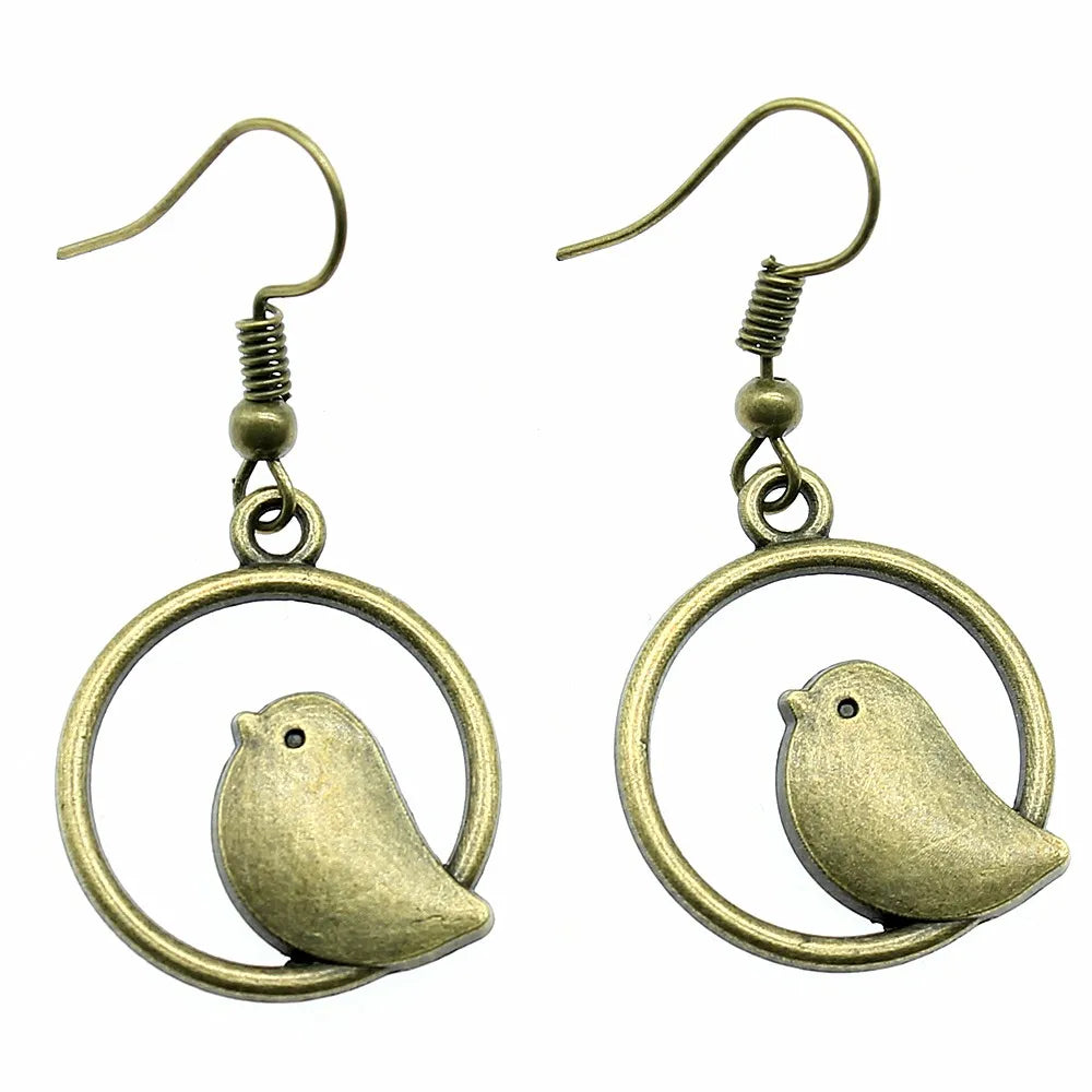 Boucles d'oreilles pendantes vintage avec pendentif oiseau – Bijoux bohèmes faits main