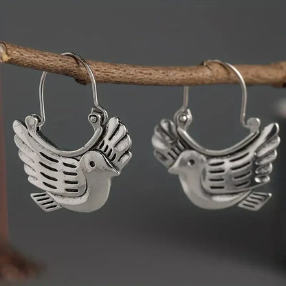 Boucles d'oreilles pendantes inspirées des oiseaux bohèmes – Ton argenté