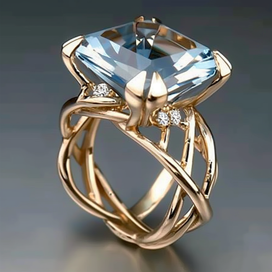 Bague vintage tressée en or et verre bleu