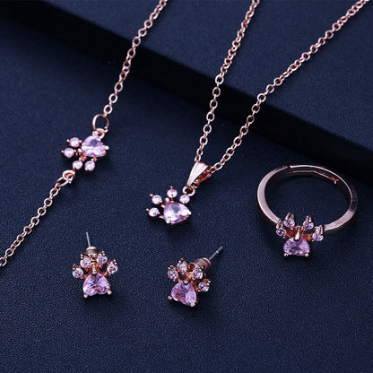 Ensemble de bijoux en or rose avec motif patte – 4 pièces avec cœur en zircone (bague, collier, boucles d'oreilles, bracelet)